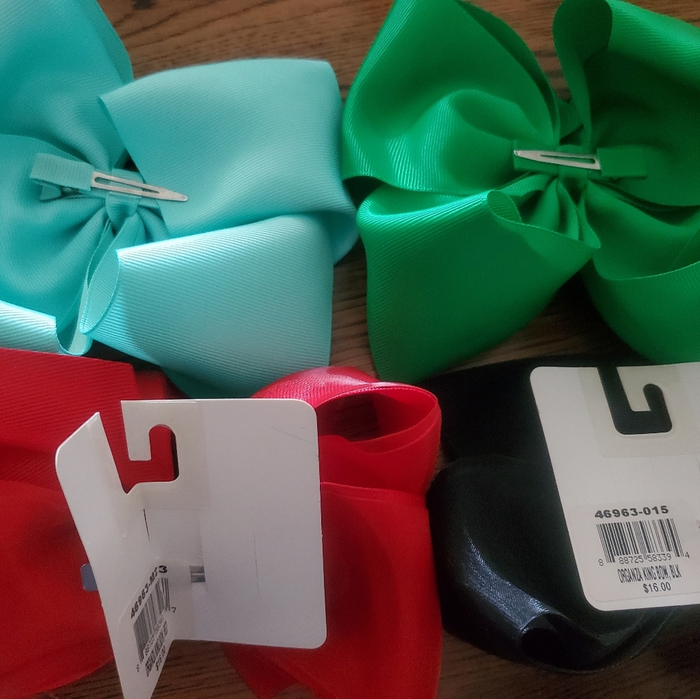 Four clip hairbows. Green,Lt. Teal, Black and Red.